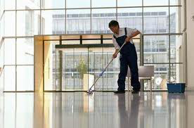 man cleaning office floors